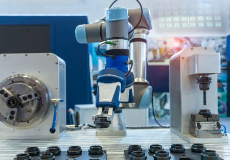 robotic arm catch for electronic assembly line. The robot for smart technology manufacturing...