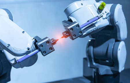 robotic arm catch for electronic assembly line. The robot for smart technology manufacturing process.の写真素材