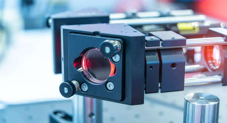 Experiment with laser device in optical laboratory