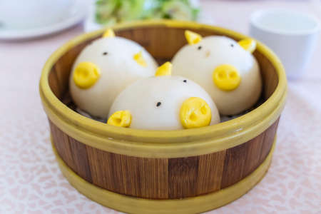 pig-shaped dumplings in bamboo steamersの写真素材