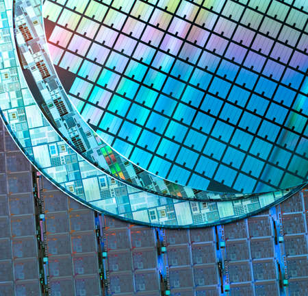 Silicon Wafer with microchips used in electronics for the fabrication of integrated circuits.の写真素材