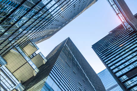 steel blue glass high rise building skyscrapers, business concept of successful industrial...