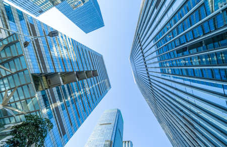 steel blue glass high rise building skyscrapers, business concept of successful industrial...