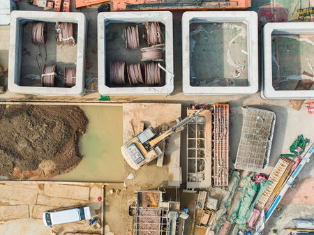 Excavator on earthmoving at construction site, aerial view.の写真素材