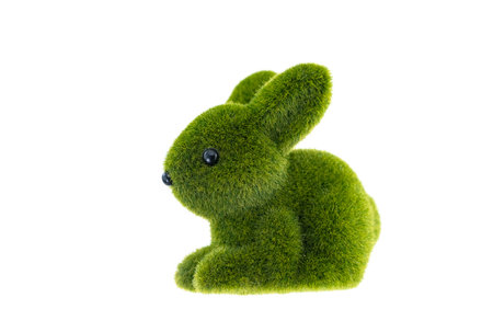 Green easter bunny rabbit statuette isolated on wite backgroundの写真素材