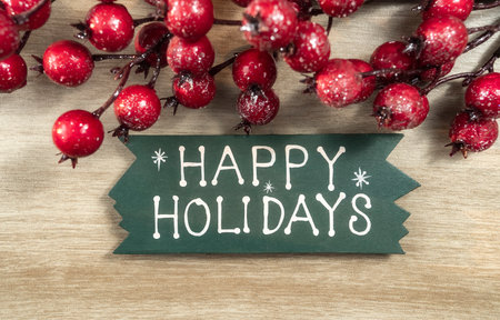 happy Holiday written on wooden backgroundの写真素材