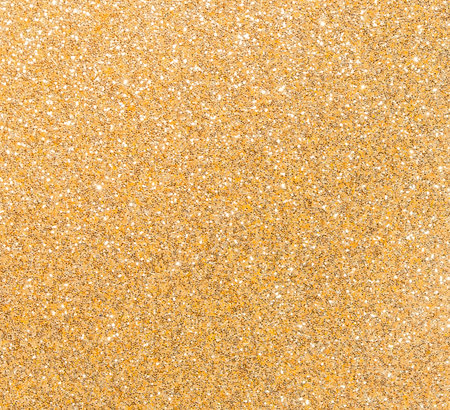 Golden glitter texture background with sequins and sparklesの写真素材