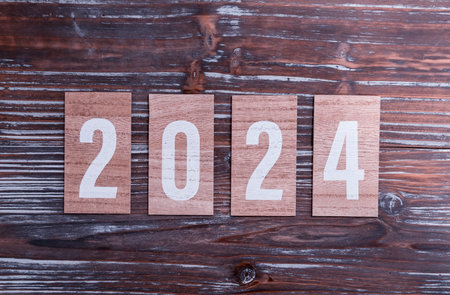The year 2024 text on wooden cardの写真素材