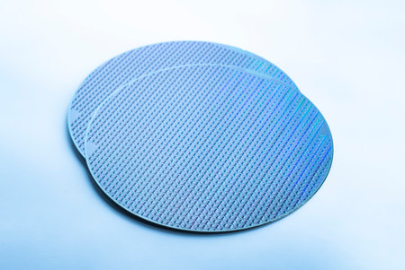 Silicon wafer with chips isolated on white backgroundの写真素材