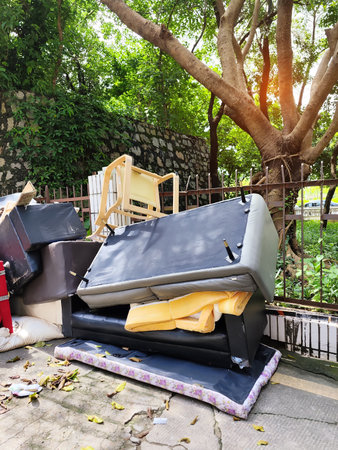 Big pile of old broken sofa furnitureの写真素材