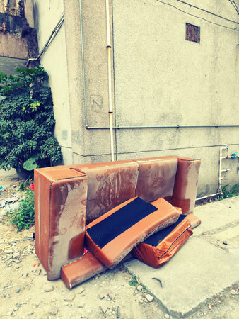 Big pile of old broken sofa furnitureの写真素材