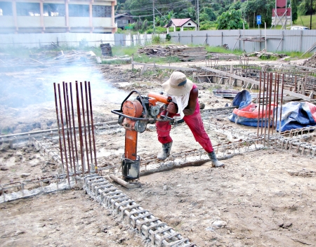 construction worker using soil tamping machine のeditorial素材