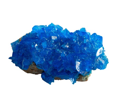 Blue mineral chalcanthite (copper sulfate) on stone on a white background