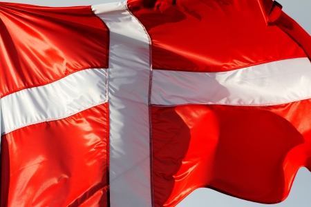 A Danish flag in the windの写真素材