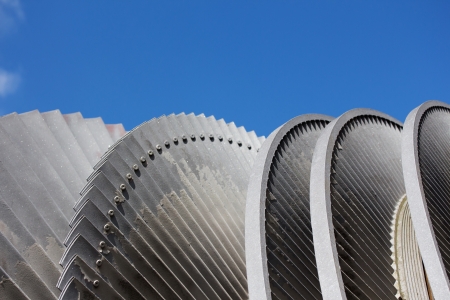 Steam turbine of nuclear power plant against sky