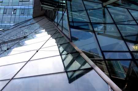 Modern architectural building with the reflection of the skyの写真素材