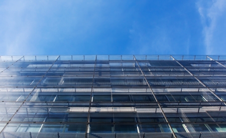 Modern glass architecture against blue sky