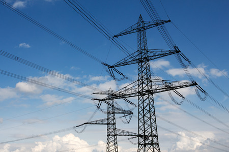 Electricity pylon against the blue sky