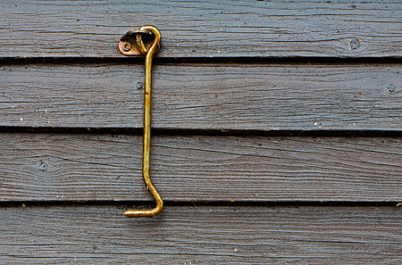 Door hook in oil on a wooden wallの写真素材