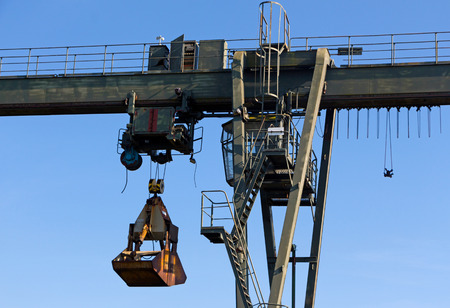 The gantry crane against a blue sky