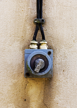 Old electric switch on a wallの写真素材