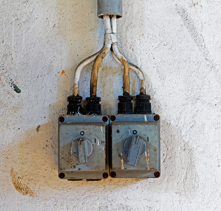 Old electric switch on a wall