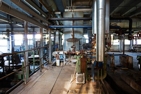Old machinery of an abandoned factory from the insideの写真素材
