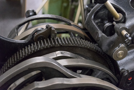 Gears of the old machine in printing house