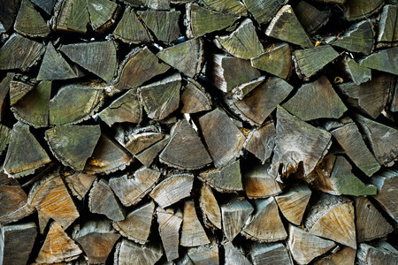 Background of a stack of old firewood