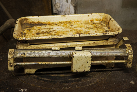 Old rusty scales in a rustic barnの写真素材