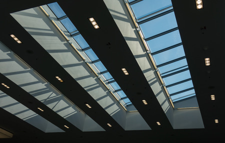 The glass roof of a building against sky