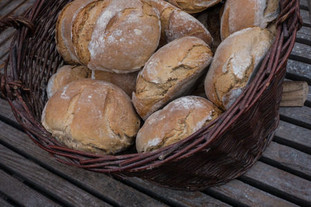 Freshly baked bread in a basket on a marketの写真素材