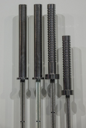 weight lifting bars on wall in fitness center
