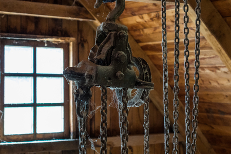 The old dusty and rusty winch in  roomの写真素材