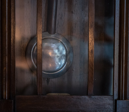 The pendulum of  old and vintage clock.の写真素材