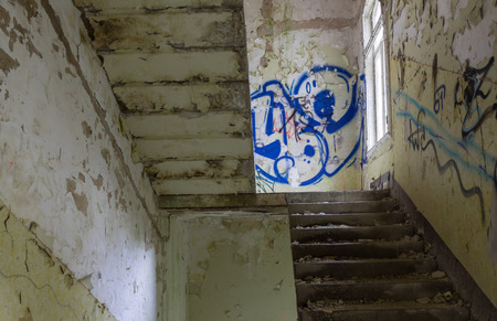 The old staircase in abandoned ruined building, lost places.の写真素材