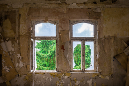 The old and ruined widow of a building, lost placesの写真素材