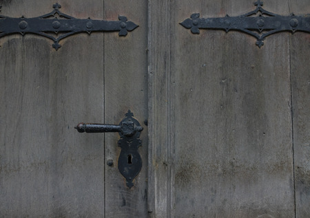 The old vintage door with handle and keyhole.の写真素材