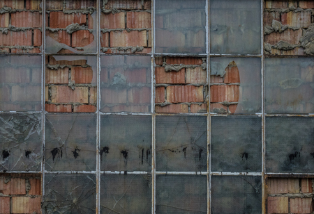 The old brick wall with glass of window.の写真素材