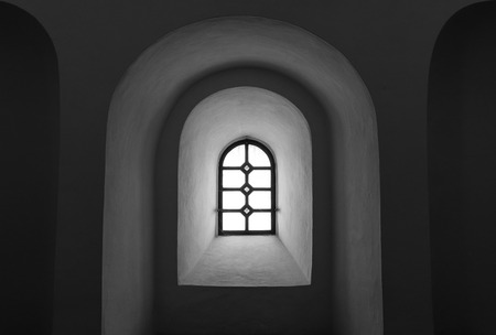 The old and ancient window in dark room .の写真素材