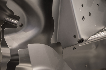 Metal parts of a car in automotive production .の写真素材