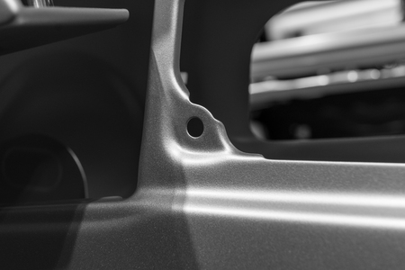Metal parts of a car in automotive production .の写真素材