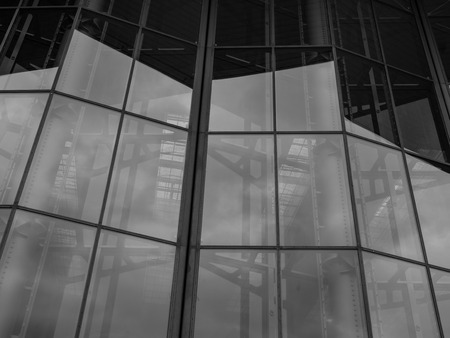 The glass architecture in city against a sky .