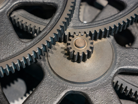 The gears of a old and vintage machine .
