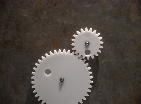 The gears of a mechanism on metal wall .の写真素材