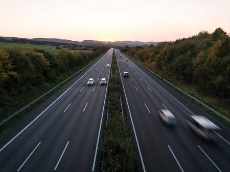 The road traffic on a motorway at sunset .の写真素材