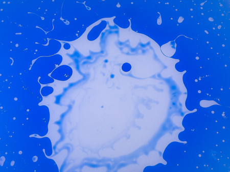 The abstract background with paints on a glass .の写真素材