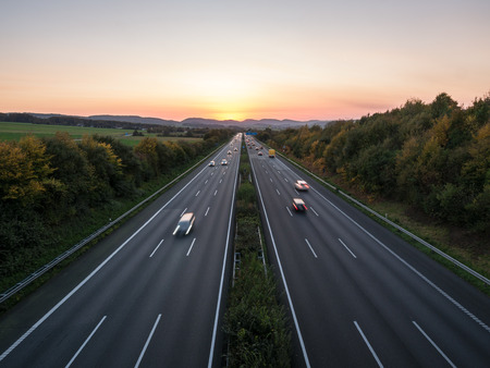 The road traffic on a motorway at sunset .の写真素材