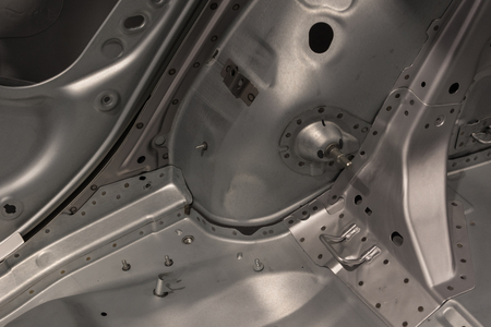 Metal parts of a car in automotive production .の写真素材
