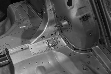 Metal parts of a car in automotive production .の写真素材